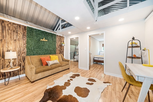 living room with vaulted ceiling and hardwood / wood-style floors