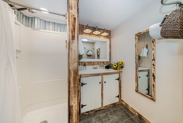 bathroom with vanity, curtained shower, and tile patterned floors