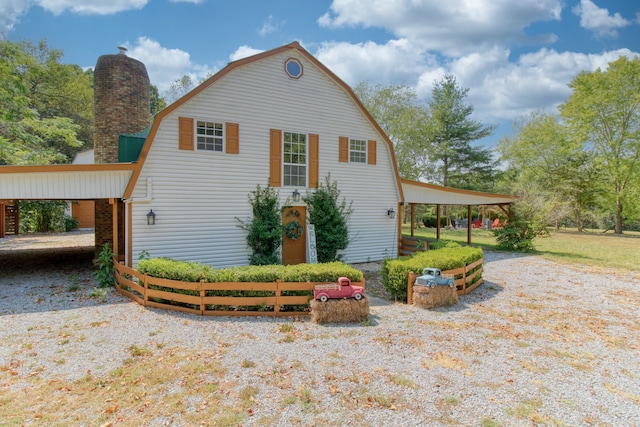 exterior space featuring a carport