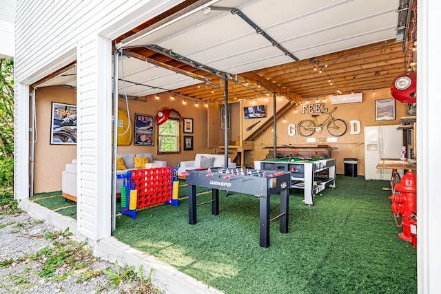 recreation room with a wall mounted air conditioner