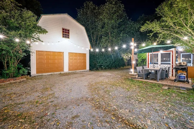 view of garage at night