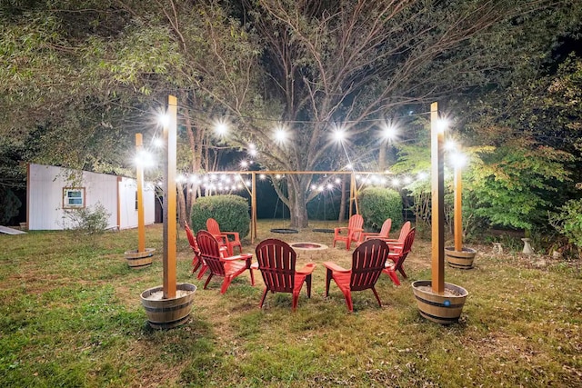 view of yard featuring an outdoor fire pit