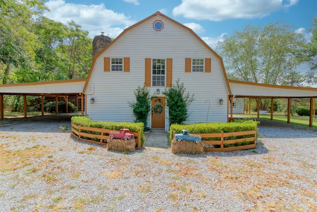 view of front property featuring a carport