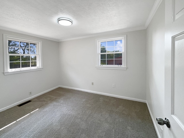 unfurnished room featuring crown molding, a textured ceiling, and dark colored carpet