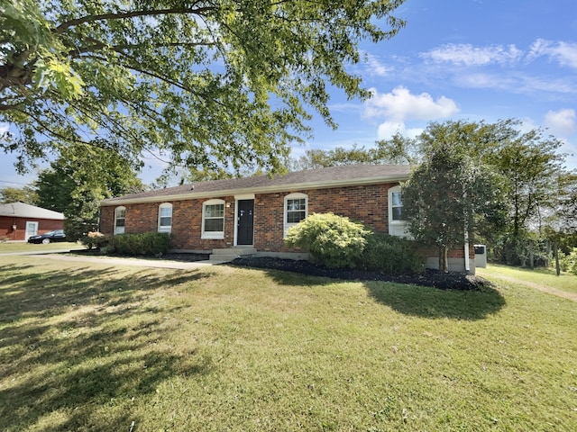 ranch-style home with a front yard