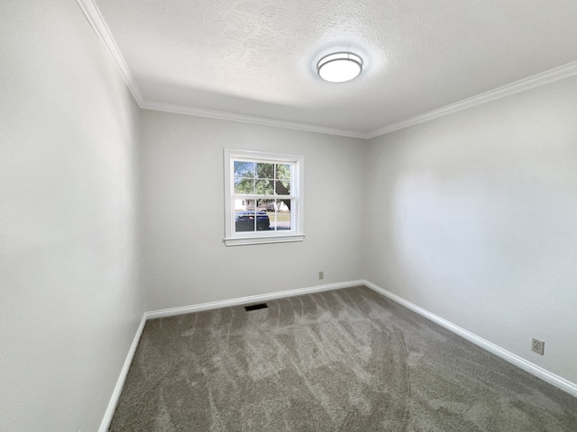 carpeted spare room featuring crown molding and a textured ceiling