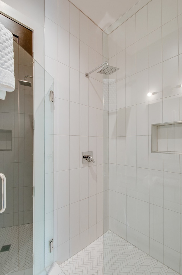 bathroom featuring an enclosed shower