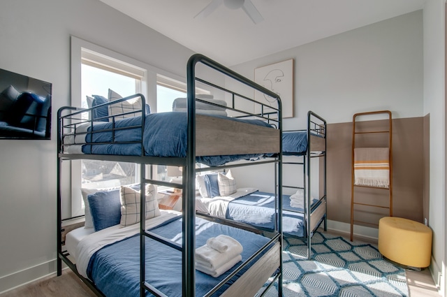 bedroom featuring hardwood / wood-style floors and ceiling fan