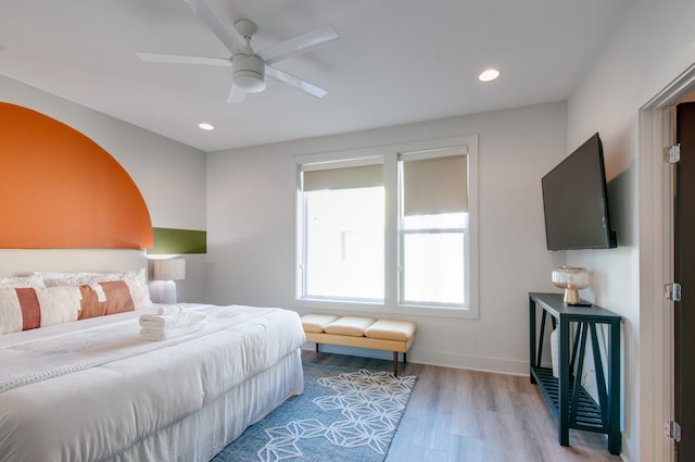 bedroom featuring ceiling fan and hardwood / wood-style flooring