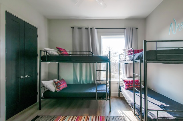 bedroom with ceiling fan and hardwood / wood-style floors