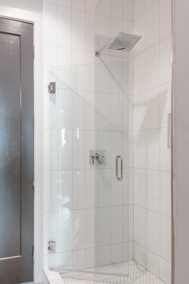 bathroom featuring an enclosed shower