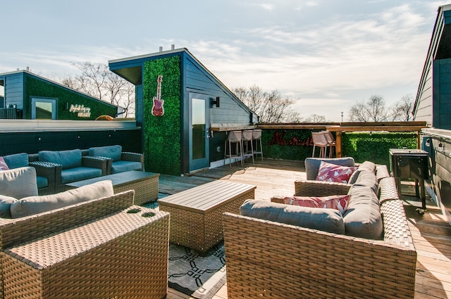 wooden deck featuring an outdoor living space