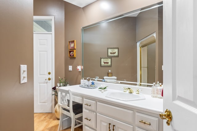 bathroom featuring vanity and wood-type flooring