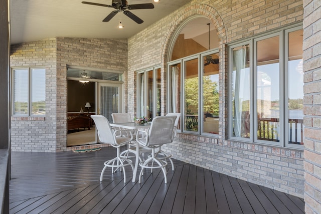 wooden terrace featuring ceiling fan