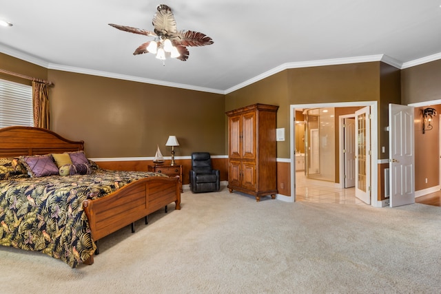 carpeted bedroom featuring ornamental molding, connected bathroom, and ceiling fan