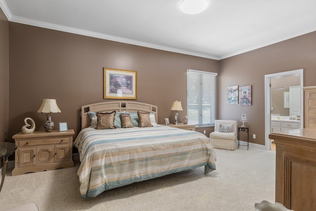 carpeted bedroom with crown molding and ensuite bath