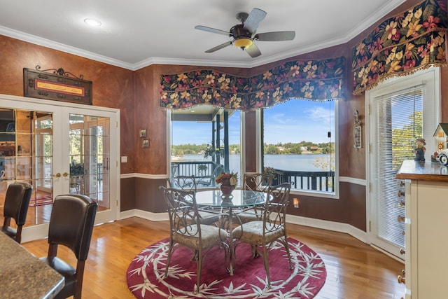 dining room with crown molding, french doors, hardwood / wood-style flooring, and ceiling fan