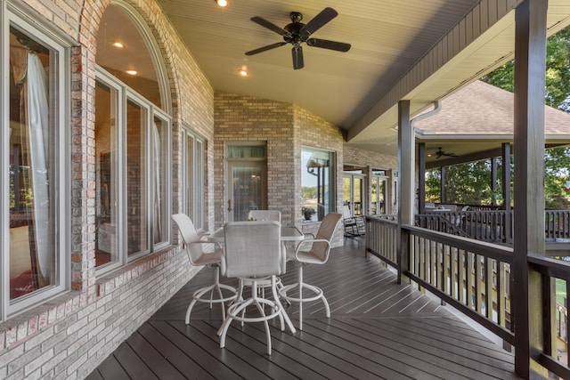 wooden deck featuring ceiling fan