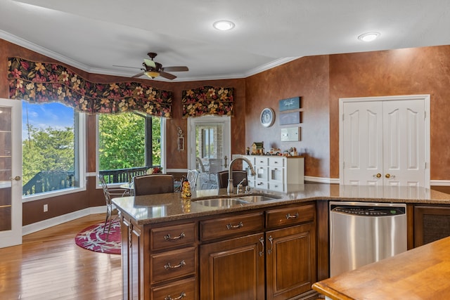 kitchen featuring crown molding, stainless steel dishwasher, sink, ceiling fan, and light wood-type flooring