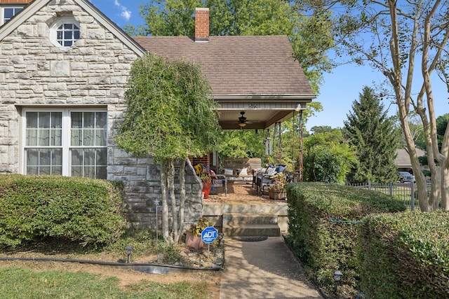 exterior space featuring ceiling fan