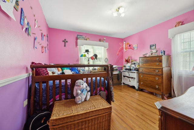 bedroom with hardwood / wood-style flooring