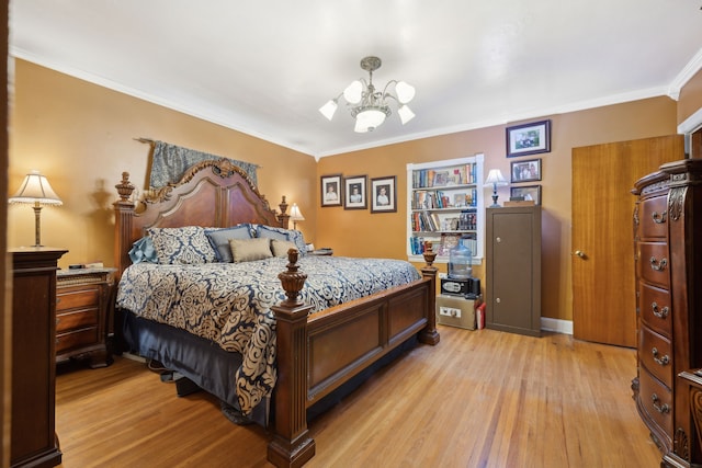 bedroom with ornamental molding, light wood-type flooring, and a chandelier