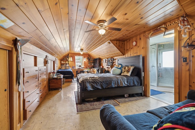 bedroom with ensuite bath, vaulted ceiling, wood ceiling, wood walls, and ceiling fan