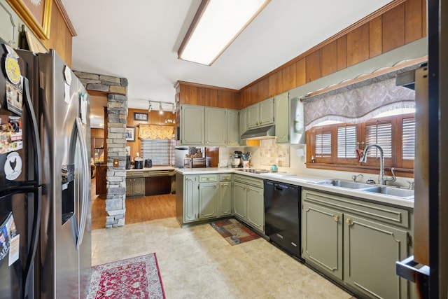 kitchen featuring green cabinets, cooktop, sink, stainless steel refrigerator with ice dispenser, and black dishwasher
