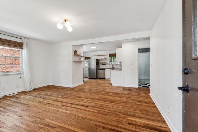 unfurnished living room with light hardwood / wood-style floors