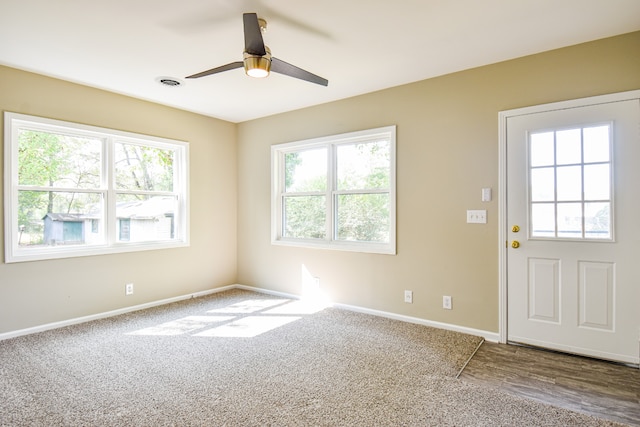 interior space with hardwood / wood-style floors and ceiling fan