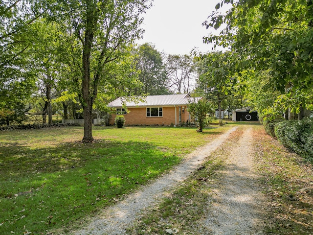 ranch-style home with a front yard