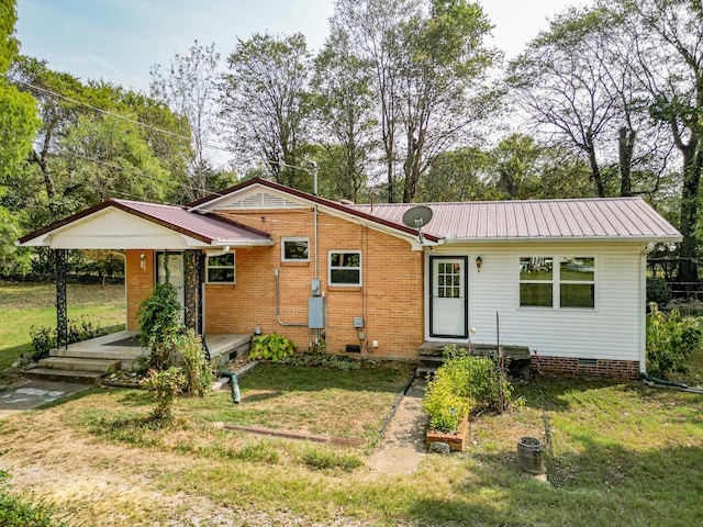 ranch-style home with a front yard