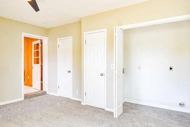 unfurnished bedroom with light carpet and ceiling fan