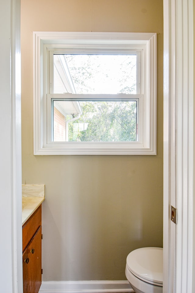 bathroom featuring vanity and toilet