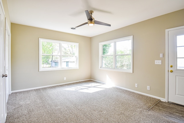 unfurnished room featuring ceiling fan and carpet floors