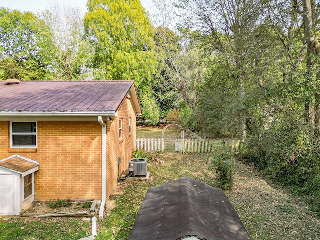 view of yard featuring central air condition unit