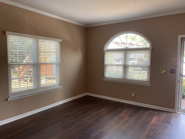 unfurnished room with dark hardwood / wood-style flooring and crown molding