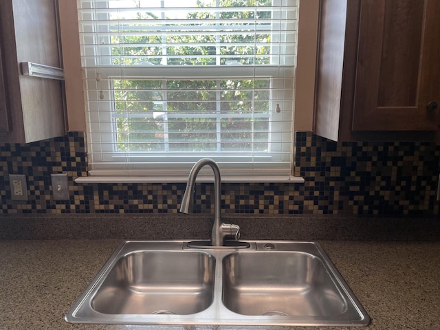 kitchen featuring sink and backsplash