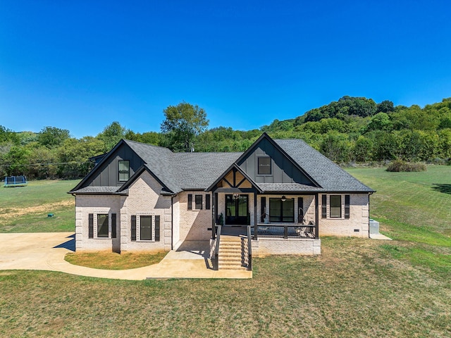 view of front of house featuring a front yard and a porch