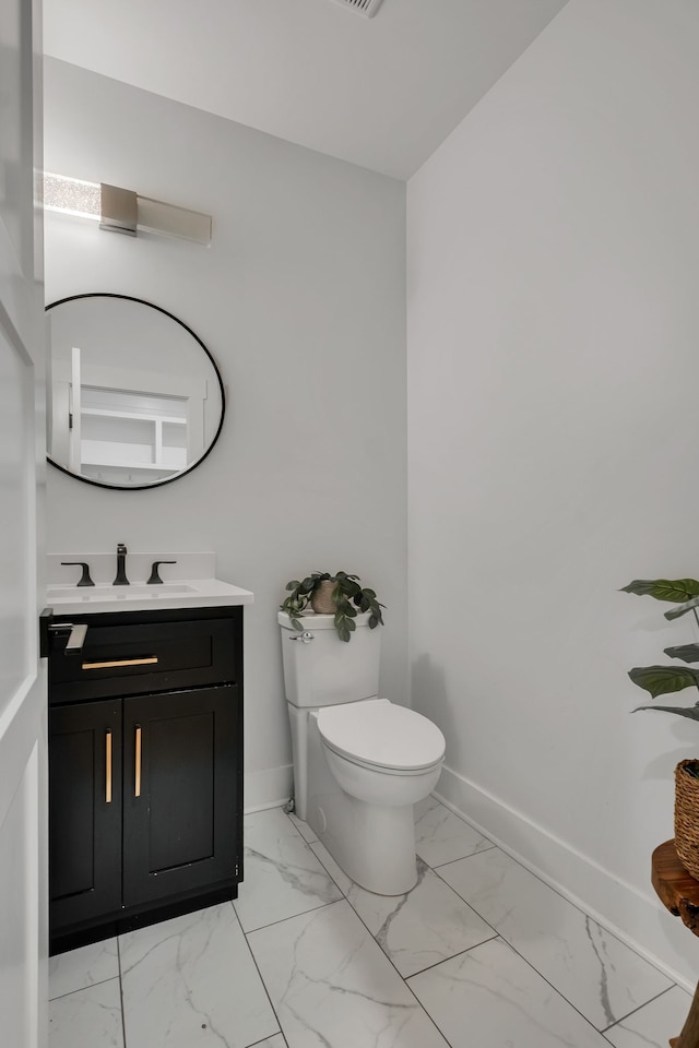 bathroom with vanity and toilet