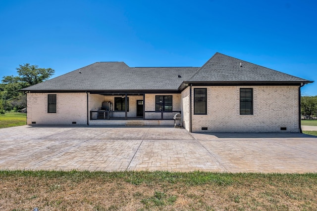 back of property featuring a patio