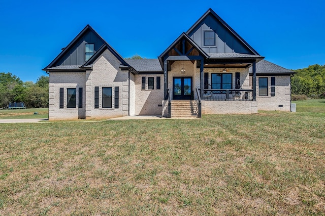 view of front of home featuring a porch and a front lawn