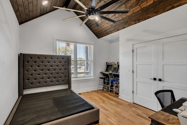 interior space featuring wood ceiling, lofted ceiling, light hardwood / wood-style flooring, and ceiling fan