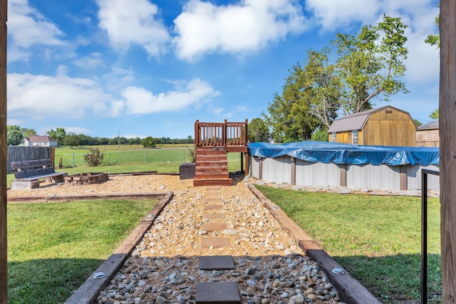 view of yard with a covered pool