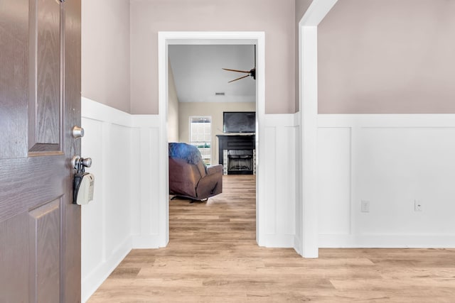 hall with light hardwood / wood-style floors