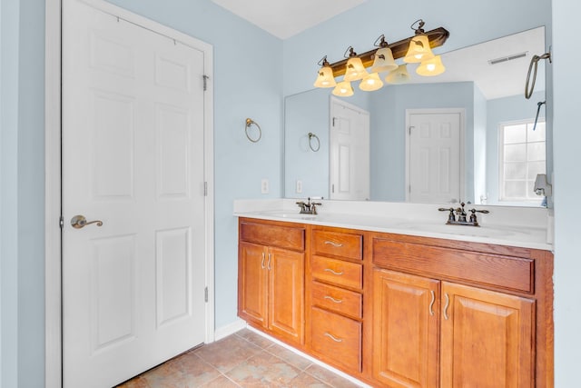 bathroom with vanity and tile patterned flooring