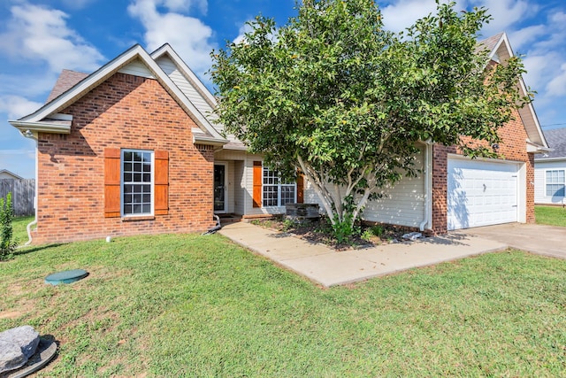 view of front of house with a garage and a front lawn