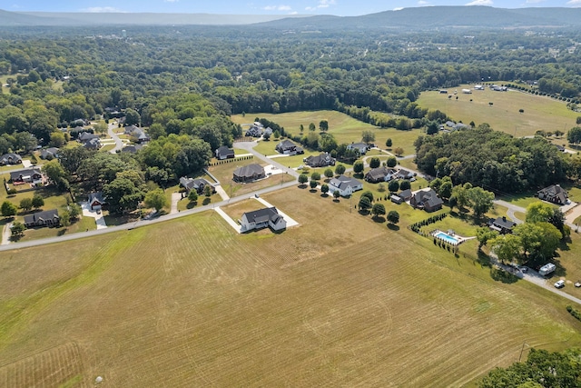 birds eye view of property with a rural view