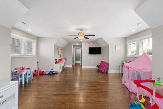 recreation room featuring ceiling fan and dark hardwood / wood-style floors