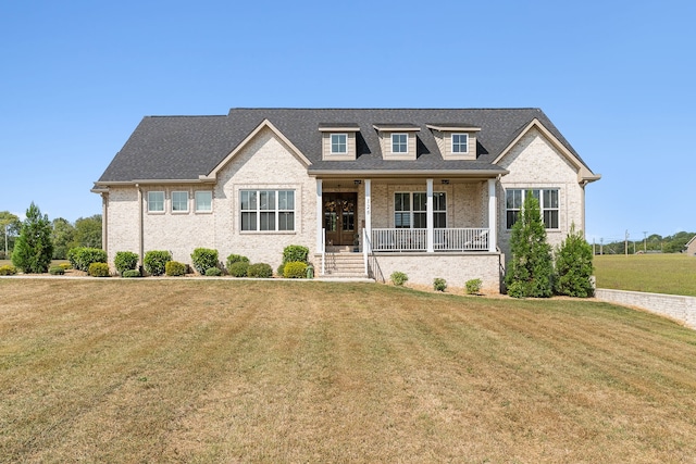 view of front facade with a front yard and a porch